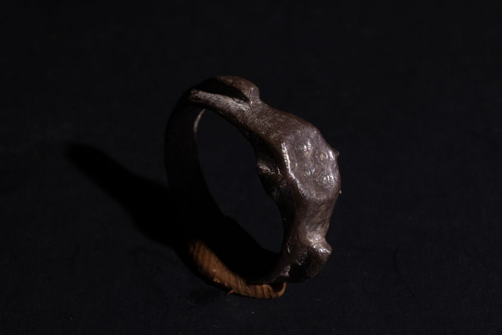 Lot 251: A Late Roman Silver Ring with Geometric Patterned...