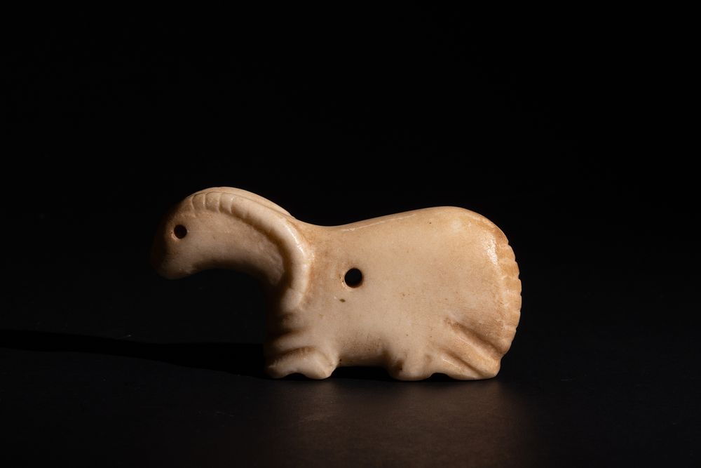 Lot 252: A Near Eastern Marble Figure of a Mountain...