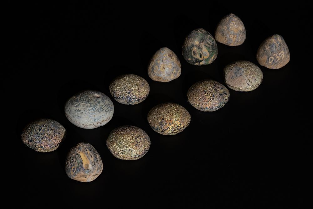 Lot 254: A Lot of 12 Ancient Glass Game Pieces,...