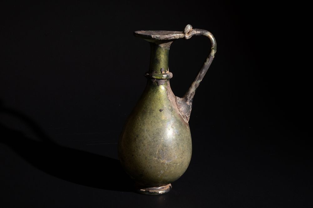 Lot 256: A Roman Pale Green Glass Jug Circa 4th...