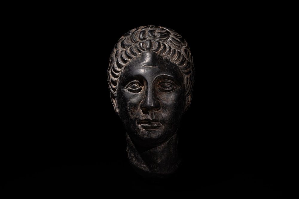 Lot 258: A Roman Style Hardstone Head of a Young...