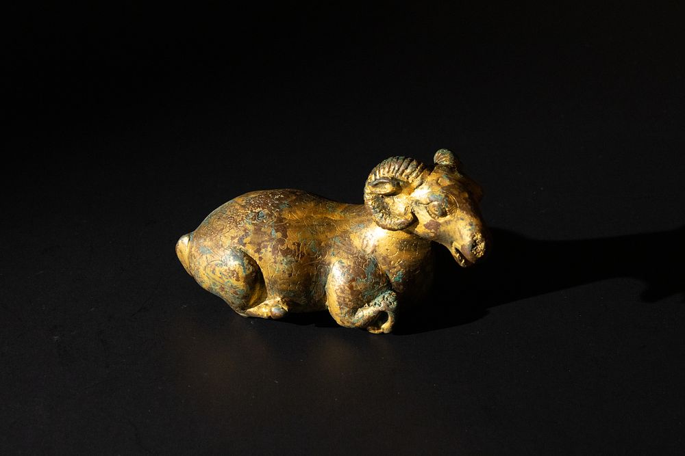 Lot 151: A Chinese Bronze Gilted Figure of a Ram.