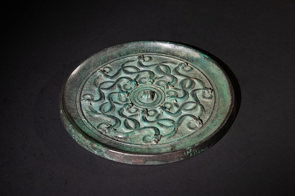 Lot 152: A Chinese Bronze Mirror, Decorated with 16 Dragons,...