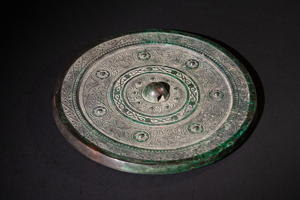 Lot 154: A Large Chinese Bronze Mirror, Decorated with Dragons,...