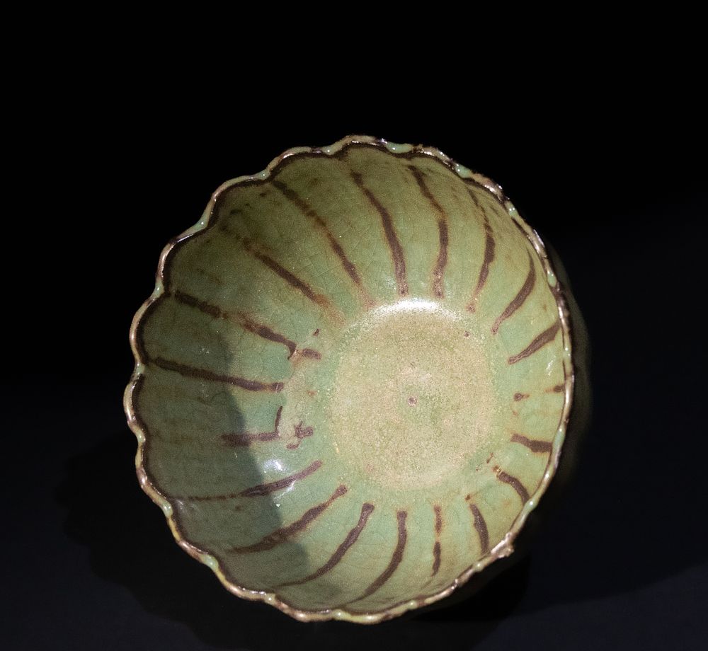 Lot 170: A Chinese Celadon Glazed Ribbed Bowl.