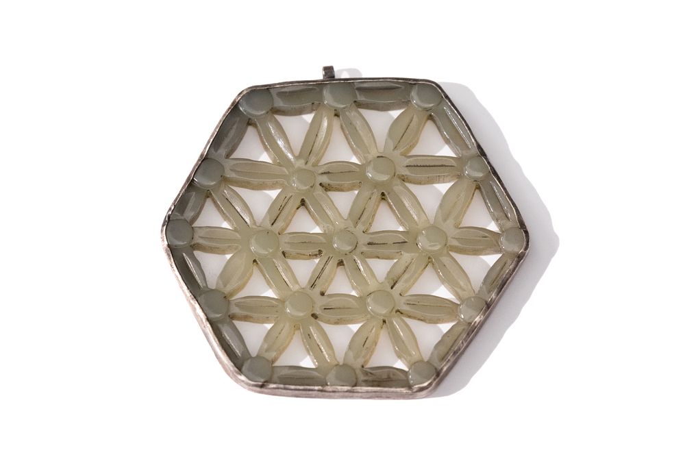 Lot 191: A Chinese Hexagonal Jade Pendant in Silver Frame.