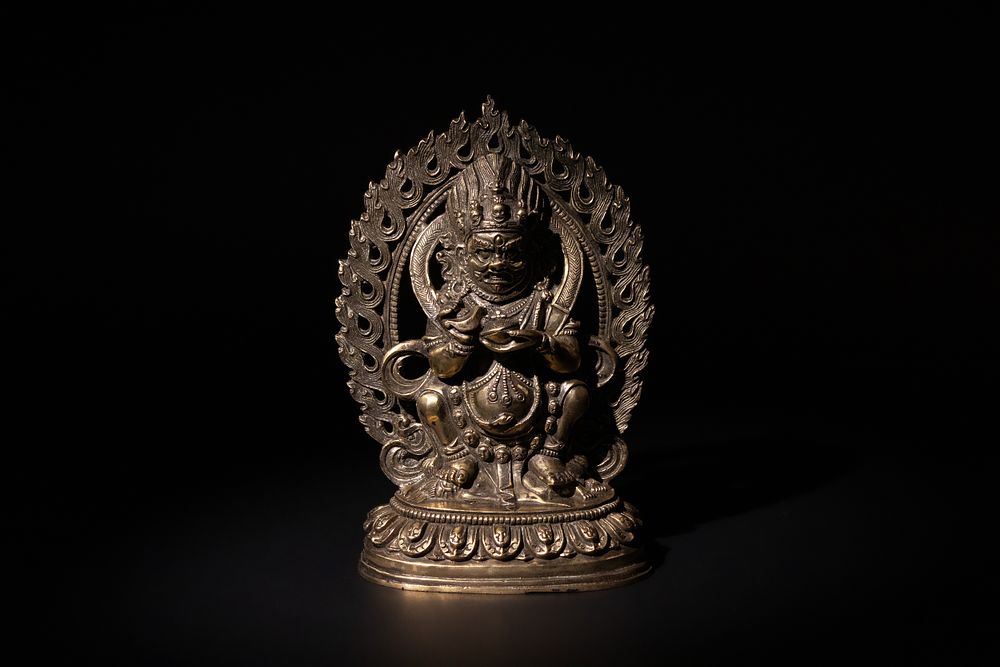 Lot 194: A Tibetan Buddhist Brass Sitting Mahakala Statue, 19th...