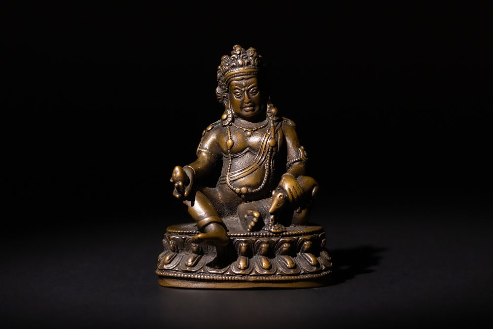 Lot 196: A Tibetan Buddhist Bronze Jambhala Statue, 19th Century.