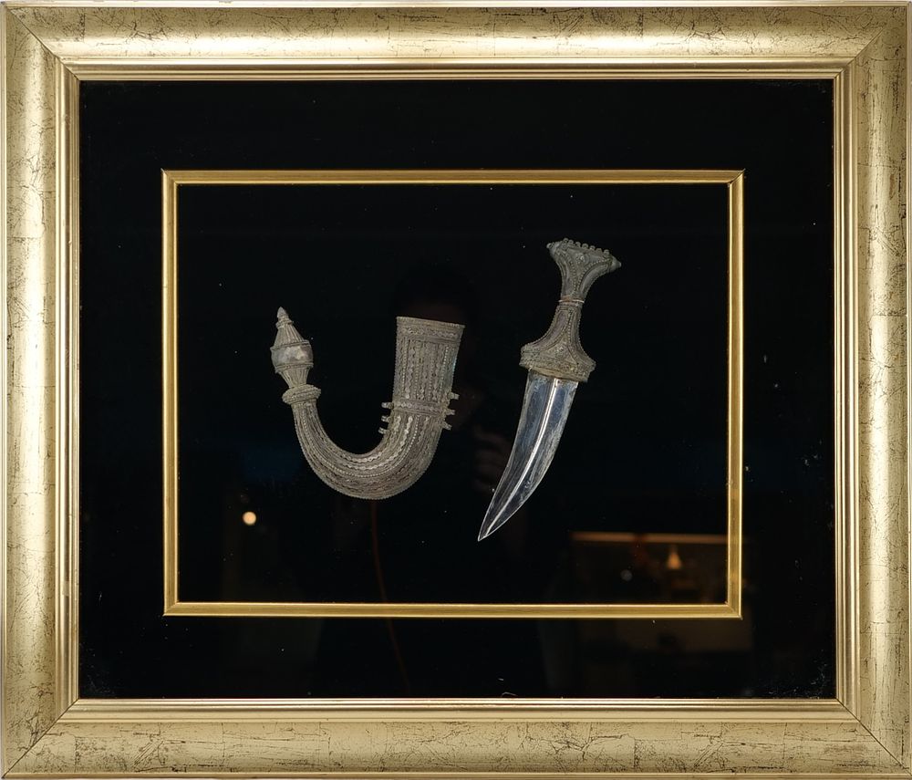 Lot 240: An Islamic Saudi Arabian Framed White Metal Dagger.