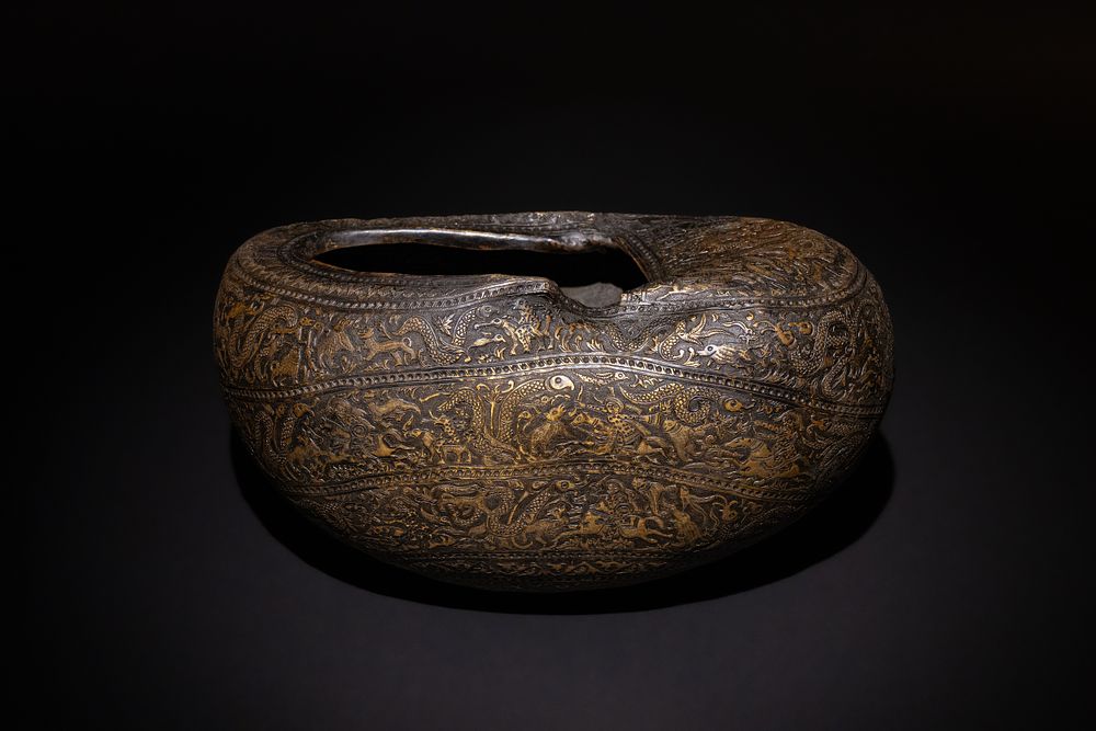 Lot 262: A Uniquely Carved Islamic Qajar Brass Kashkul Beggar's...