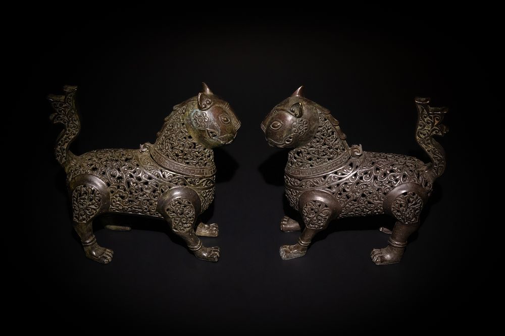 Lot 265: A Pair of Islamic Bronze Openwork Lions in...
