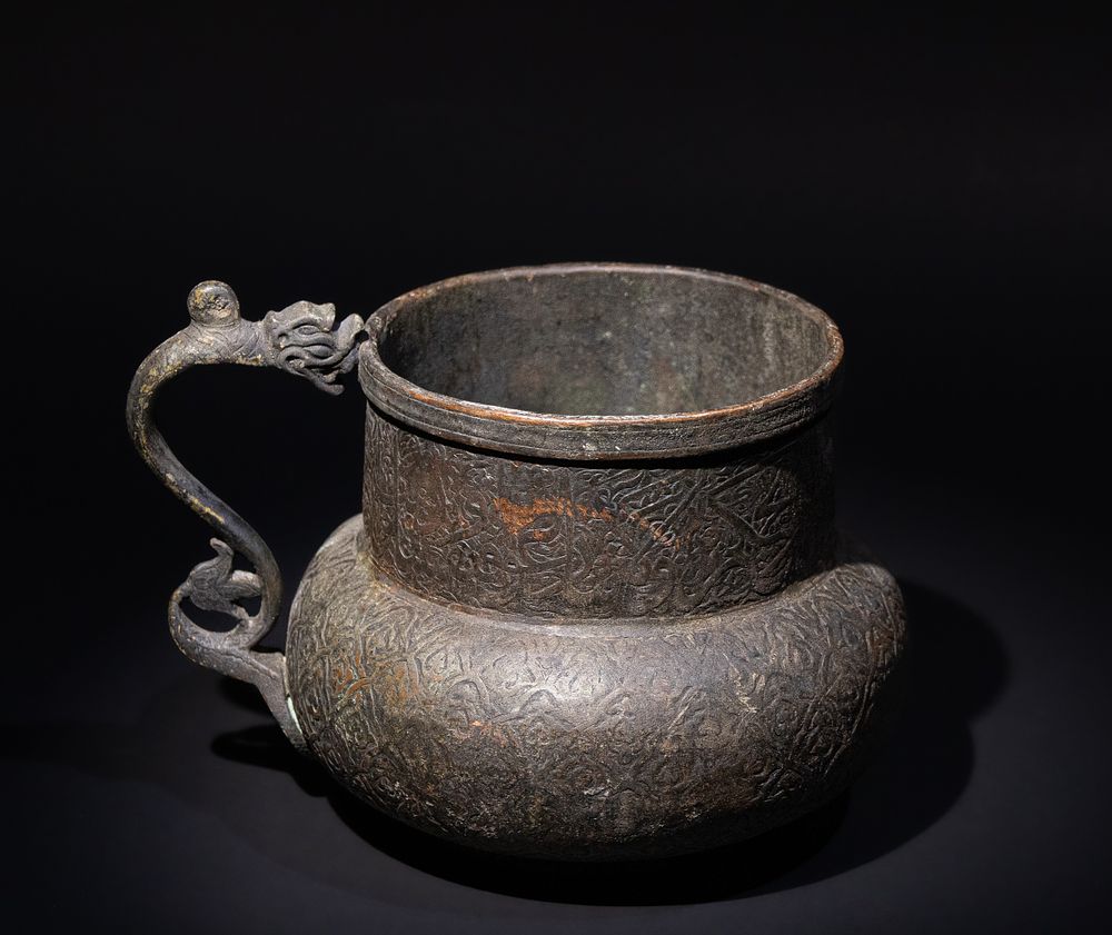 Lot 274: An Islamic Timurid Style Copper Jug, Decorated with...