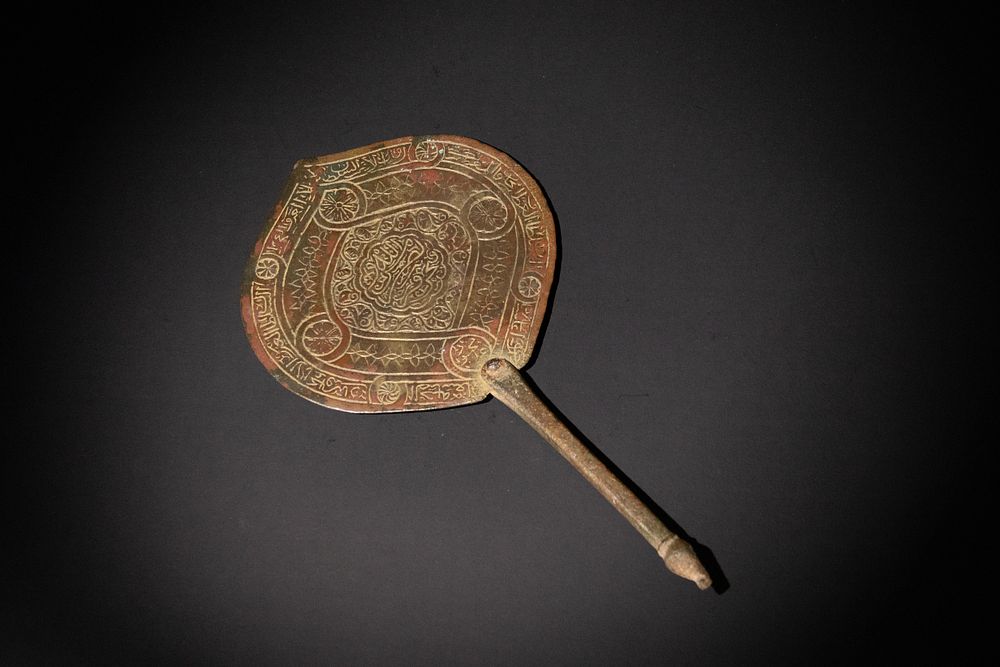 Lot 295: An Islamic Seljuk Bronze Mirror, 12th Century, Decorated...