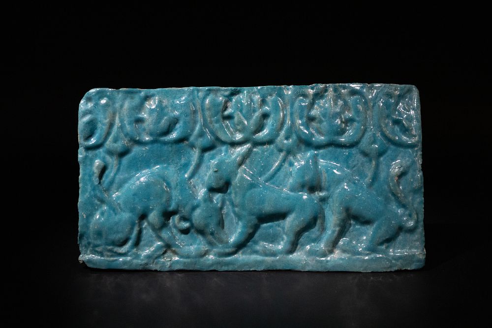 Lot 304: An Islamic Kashan Turquoise Glazed Pottery Tile, 12th...