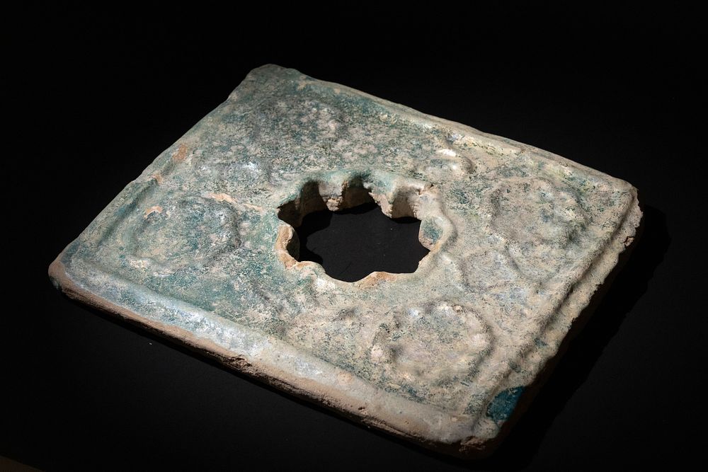 Lot 305: An Islamic Persian Turquoise Glazed Pottery Tile, 13-14th...