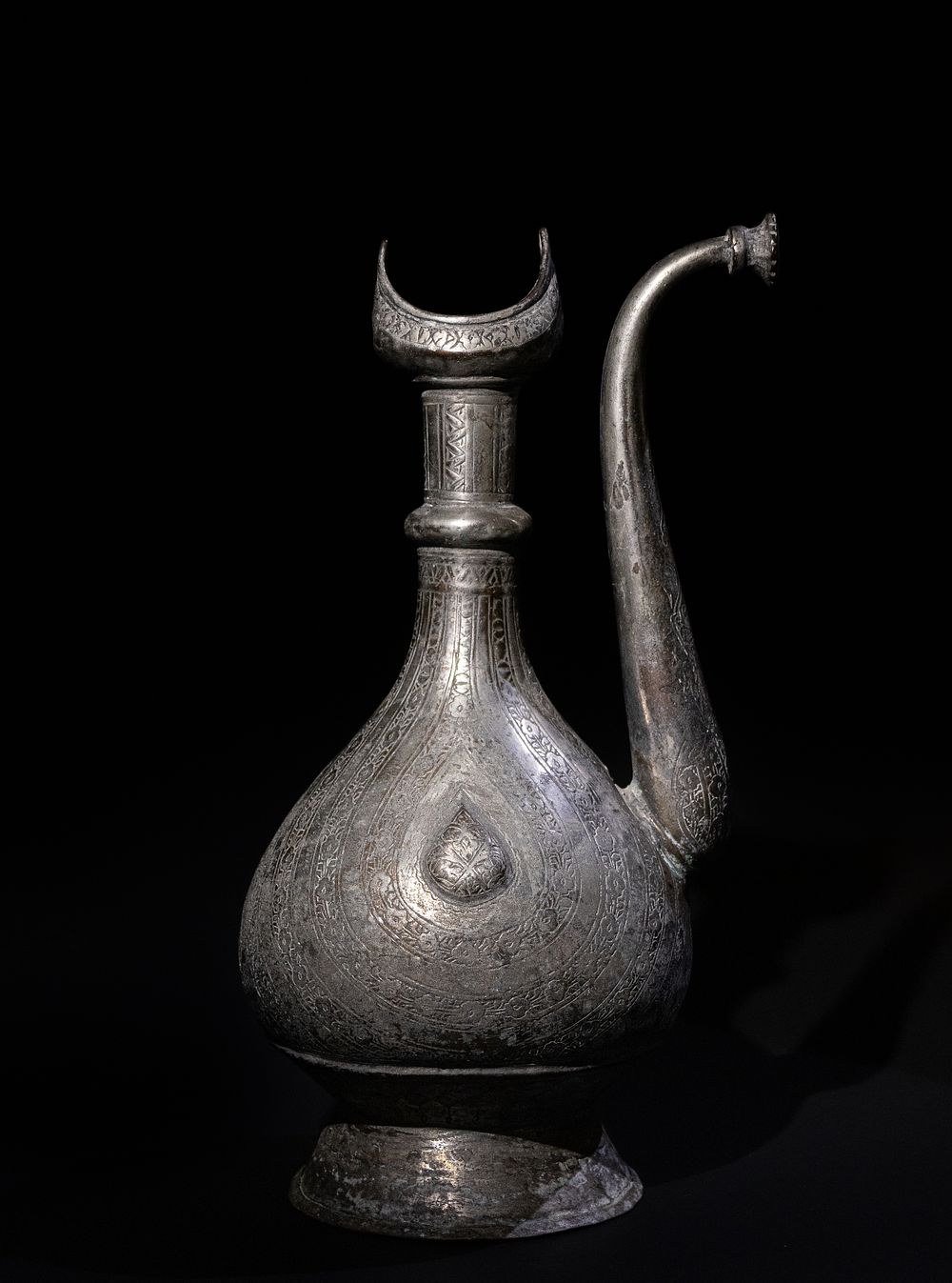 Lot 311: An Islamic Persian Tinned Copper Ewer, 19th-20th Century,...