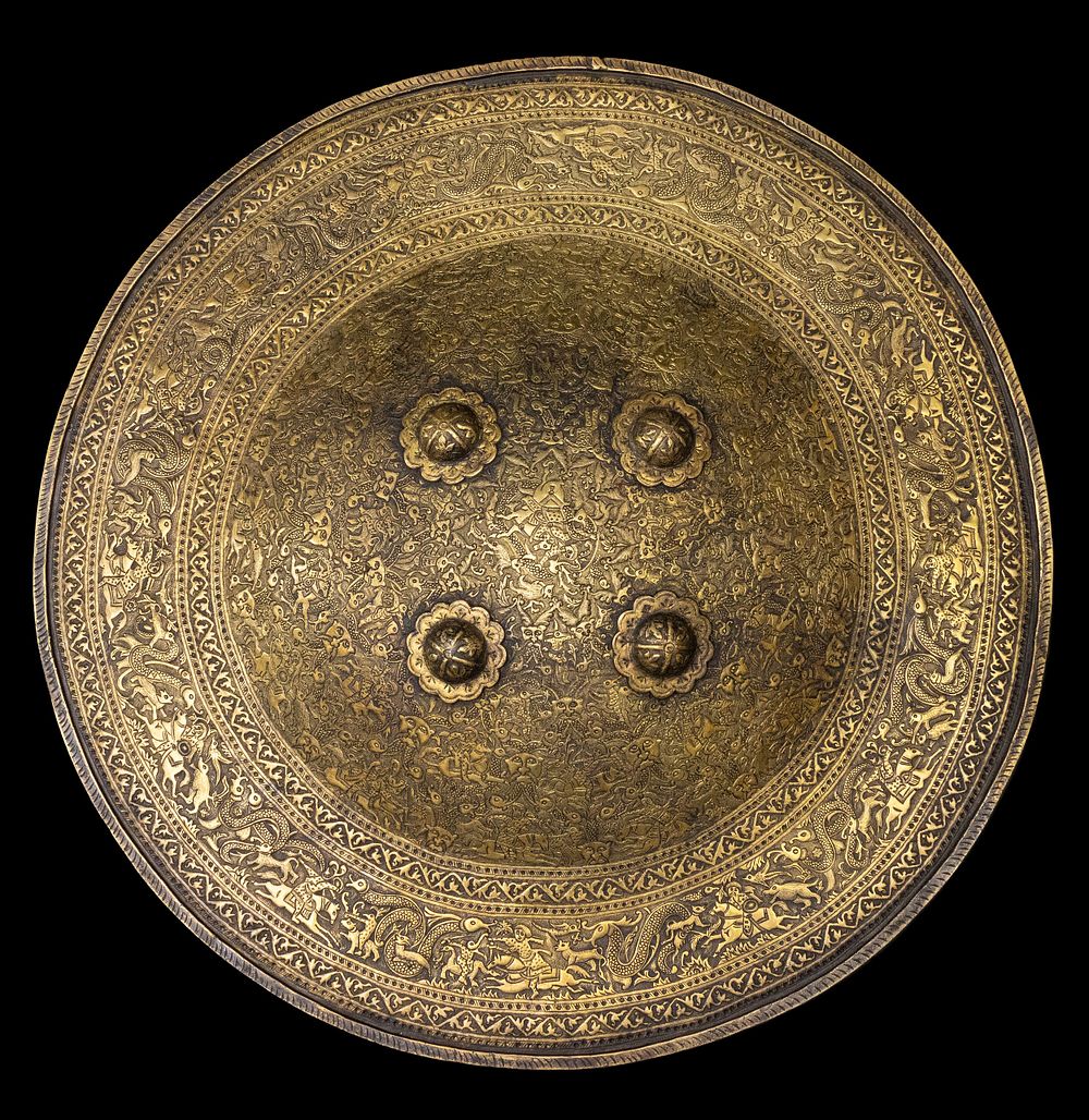 Lot 314: An Islamic Persian Qajar Brass Engraved Shield, 19th...