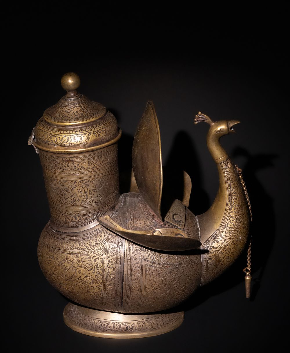 Lot 159: An Indo-Persian Brass Peacock Water Jug.