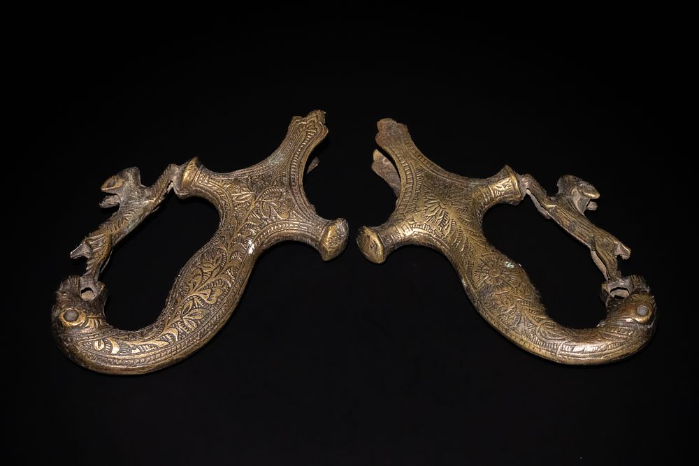 Lot 162: A Pair of Indian Brass Sword Handles with...