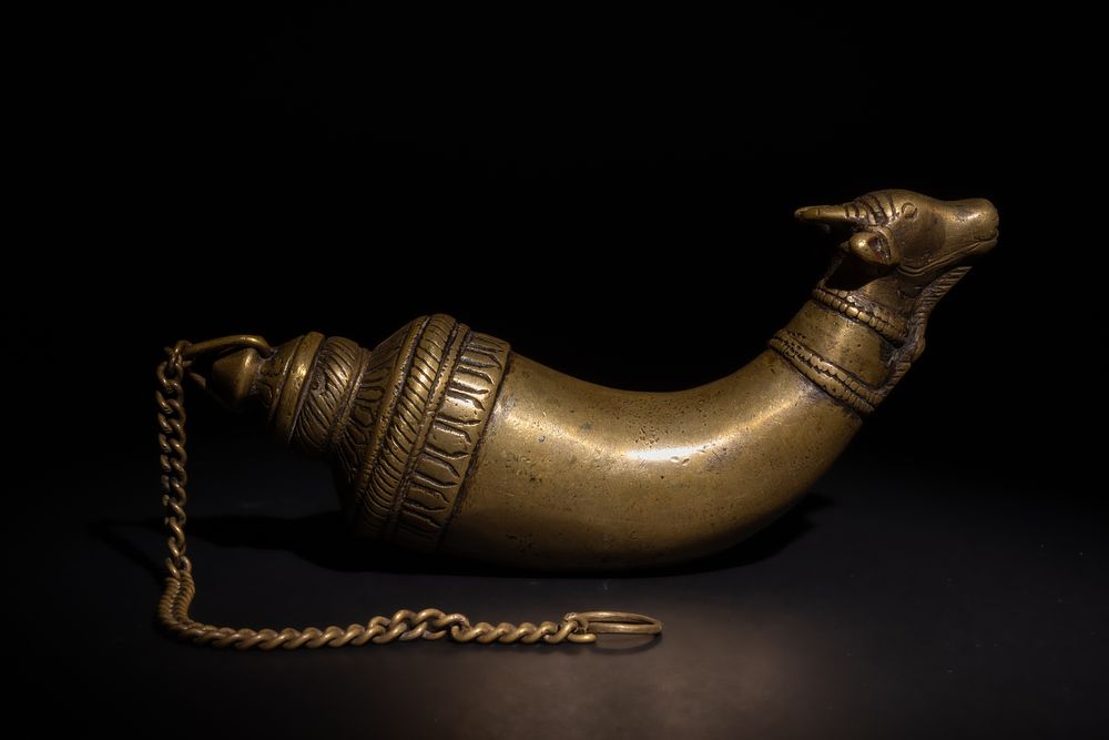 Lot 172: An Indian Mughal Bronze Gunpowder Flask with Bull...