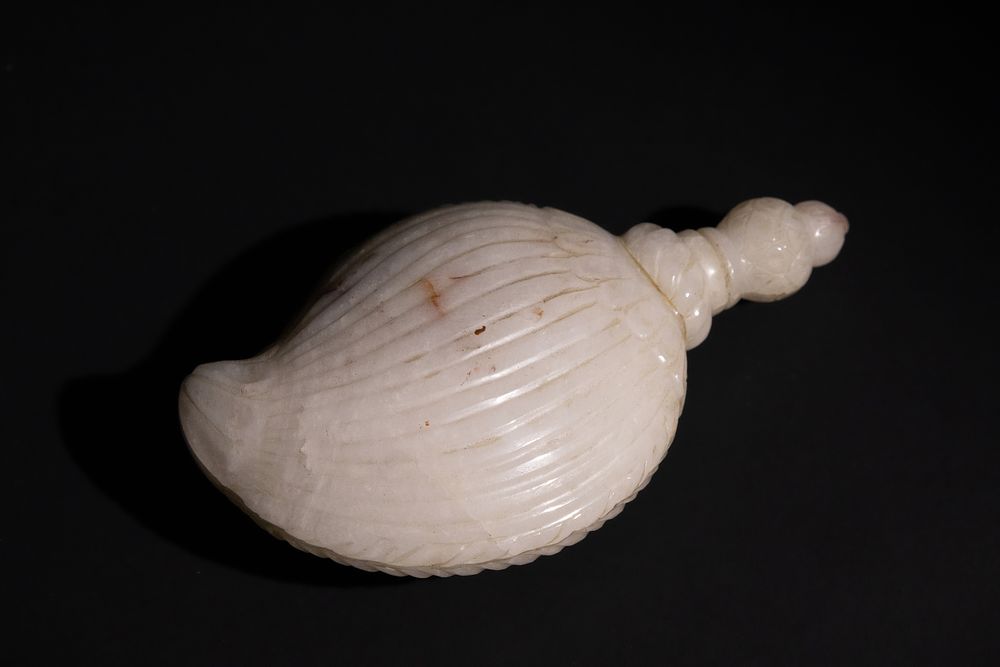 Lot 174: An Indian Carved White Jade Gunpowder Flask.