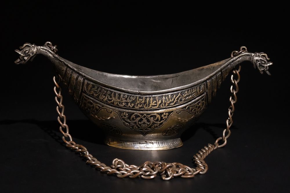 Lot 185: An Indian Deccan Brass Kashkul with Chain, 17th...