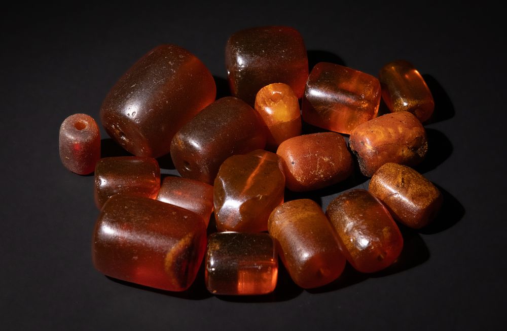 Lot 196: An Assorted Amber Beads Collection.