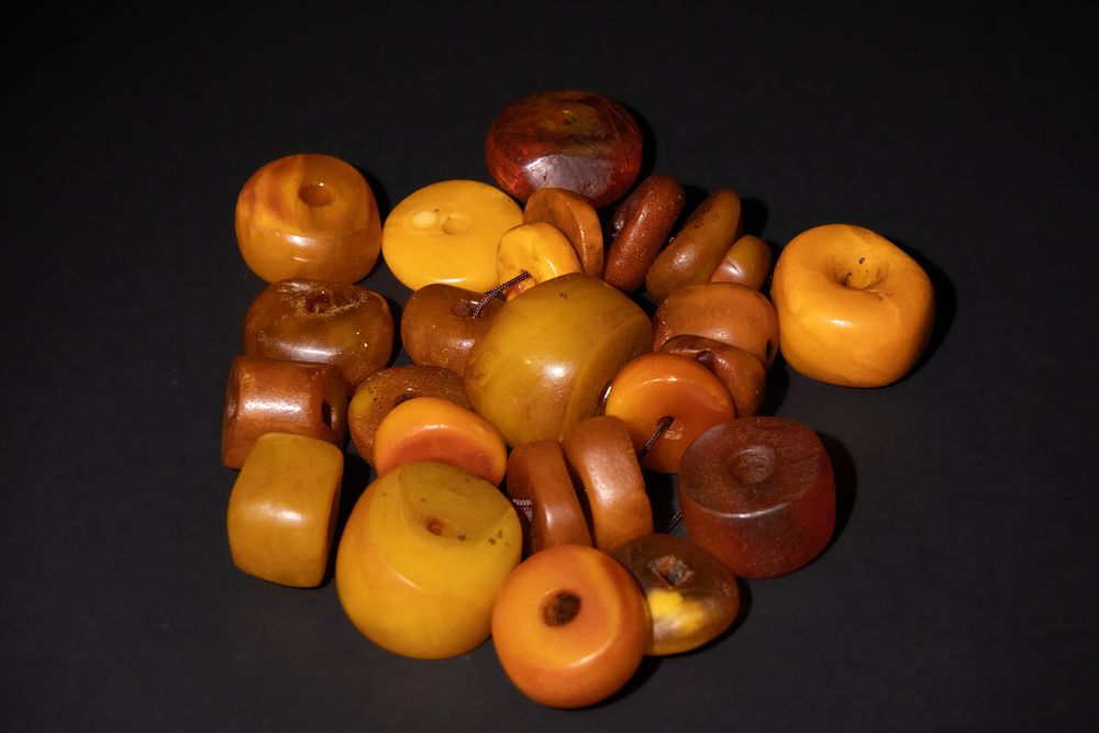 Lot 198: An Assorted Collection of Amber Beads in Various...
