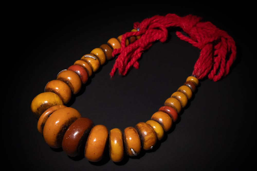 Lot 202: A Berber Resin-Amber Necklace.