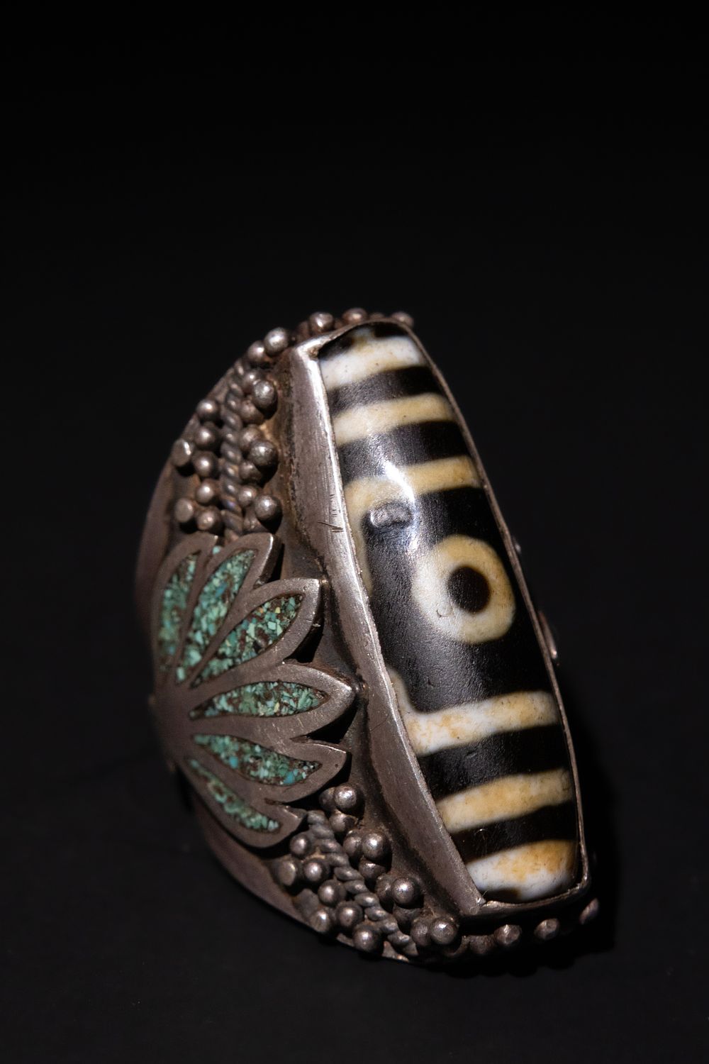 Lot 205: A Tibetan Silver Ring with Dzi Bead and...