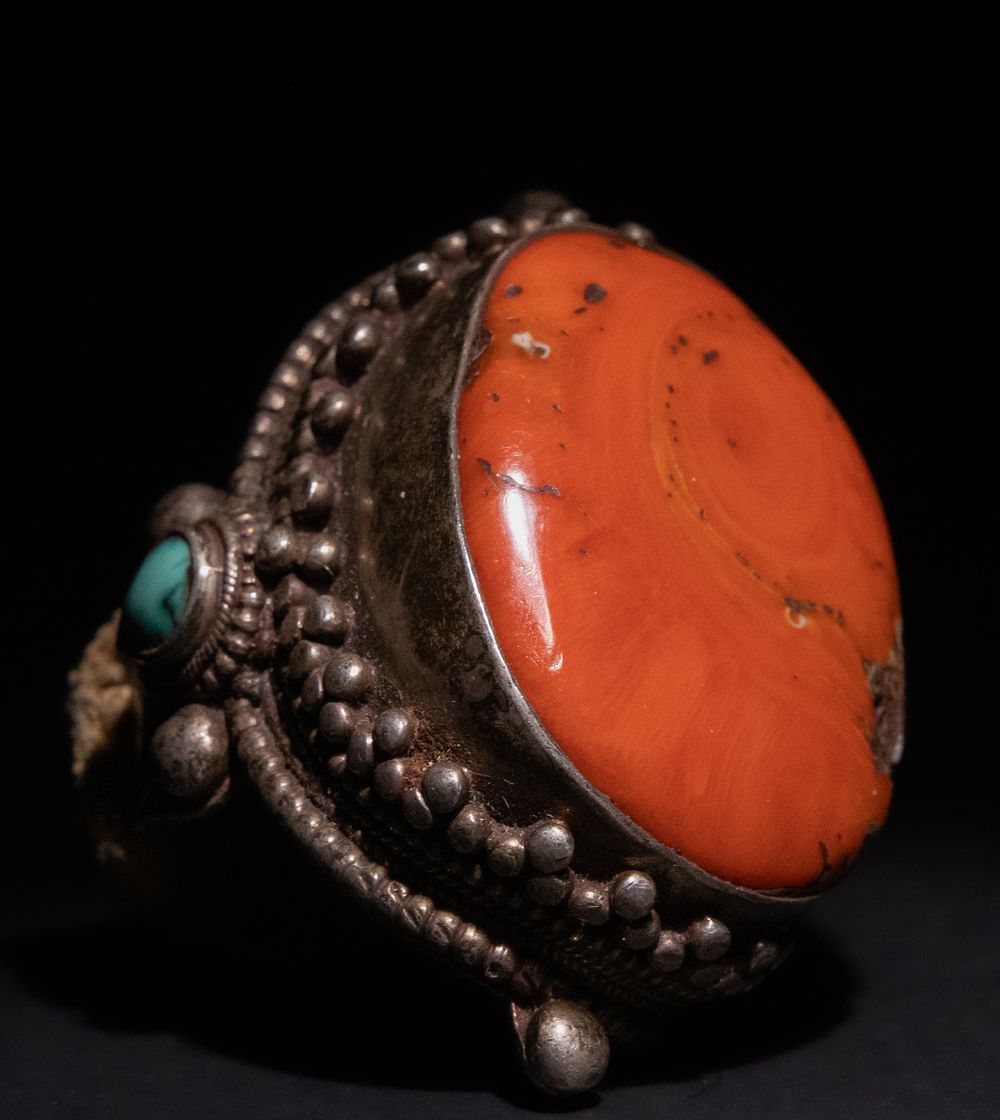 Lot 216: A Tibetan Silver Ring with Coral and Turquoise...