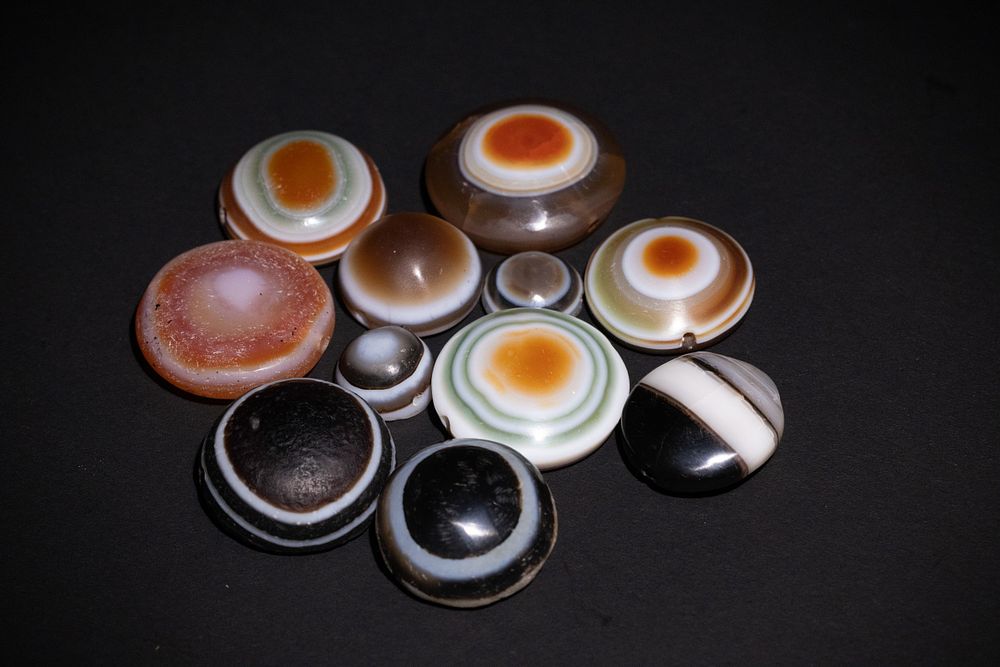 Lot 221: A Collection of Tibetan Dzi Beads.