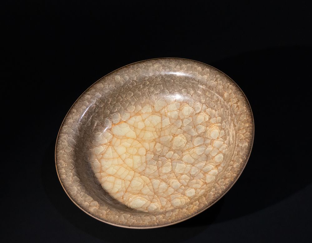 Lot 240: A Chinese Beige Crackled Porcelain Bowl.