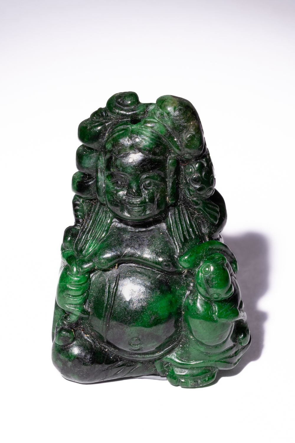 Lot 247: A Chinese Carved Green Jade Amulet of a...