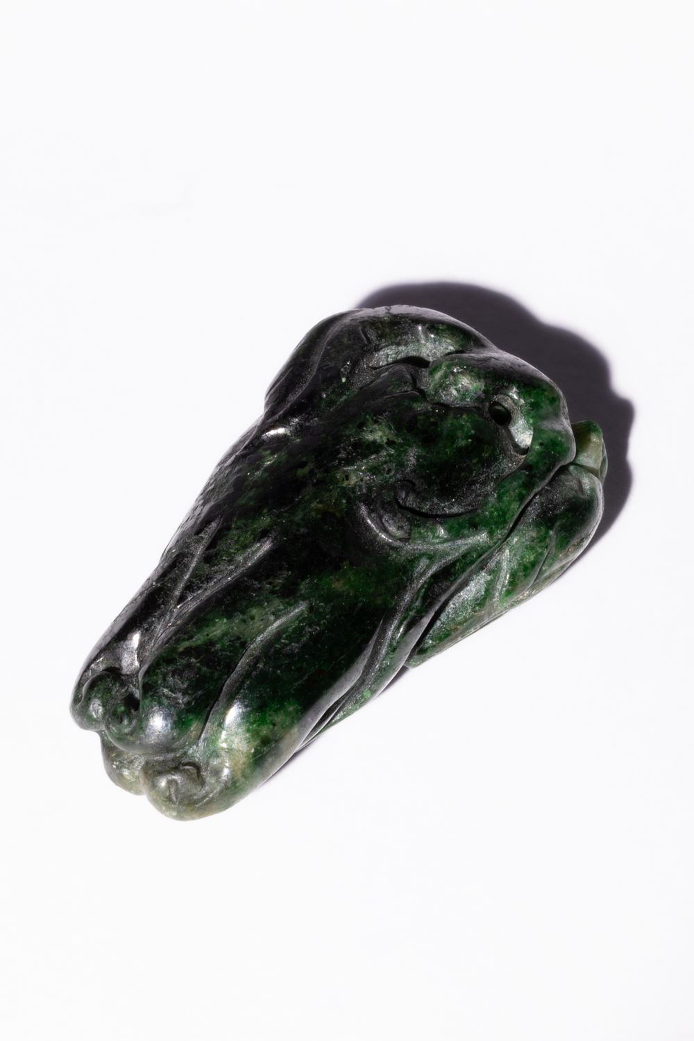 Lot 248: A Chinese Carved Green Jade Amulet of a...