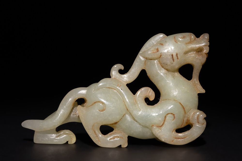 Lot 256: A Chinese Green and Russet Jade Carving of...