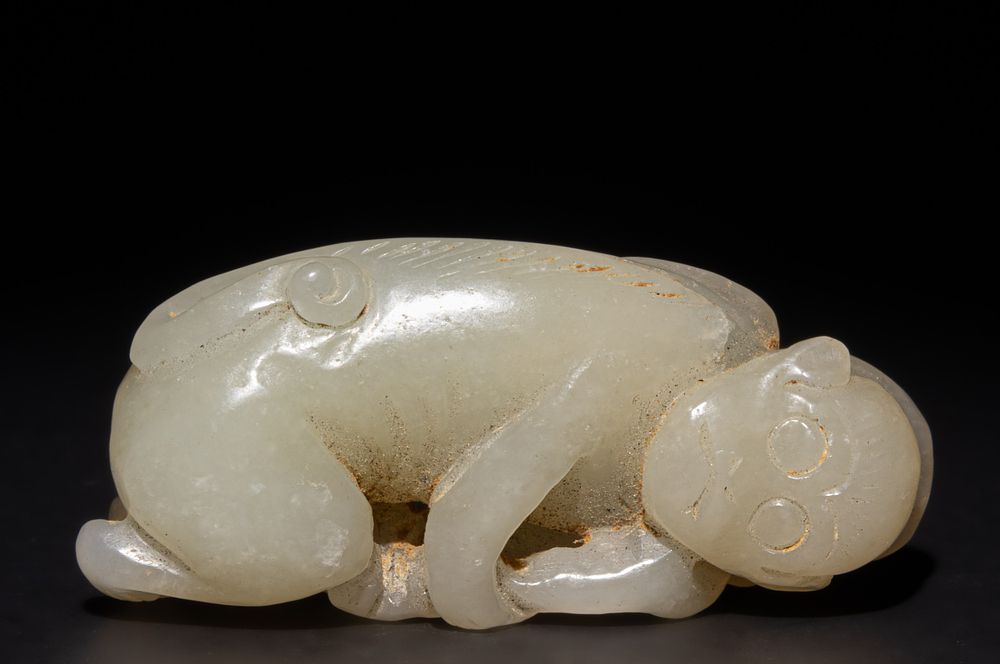 Lot 258: A Chinese Carved Jade Figure of a Reclining...