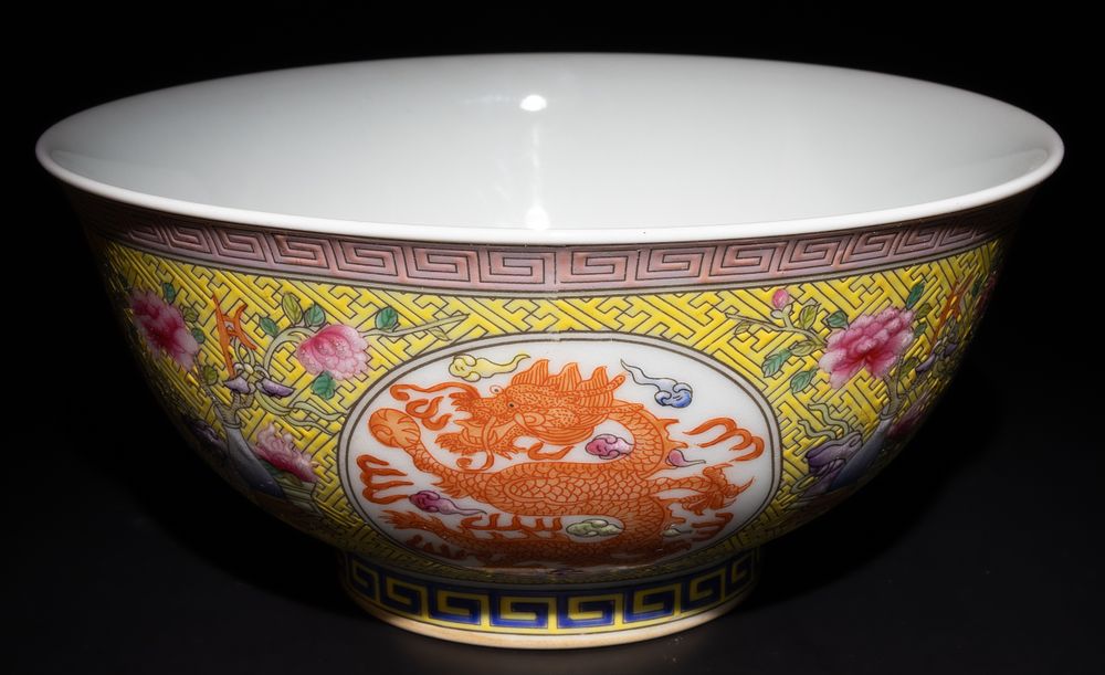 Lot 264: A Chinese Famille Rose Yellow Ground Dragon Bowl...