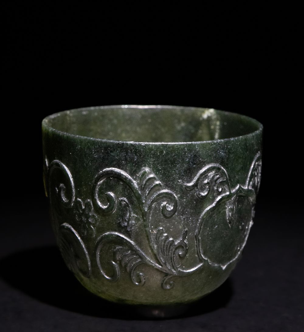 Lot 281: A Chinese Spinach Green Jade Cup, 19th Century.