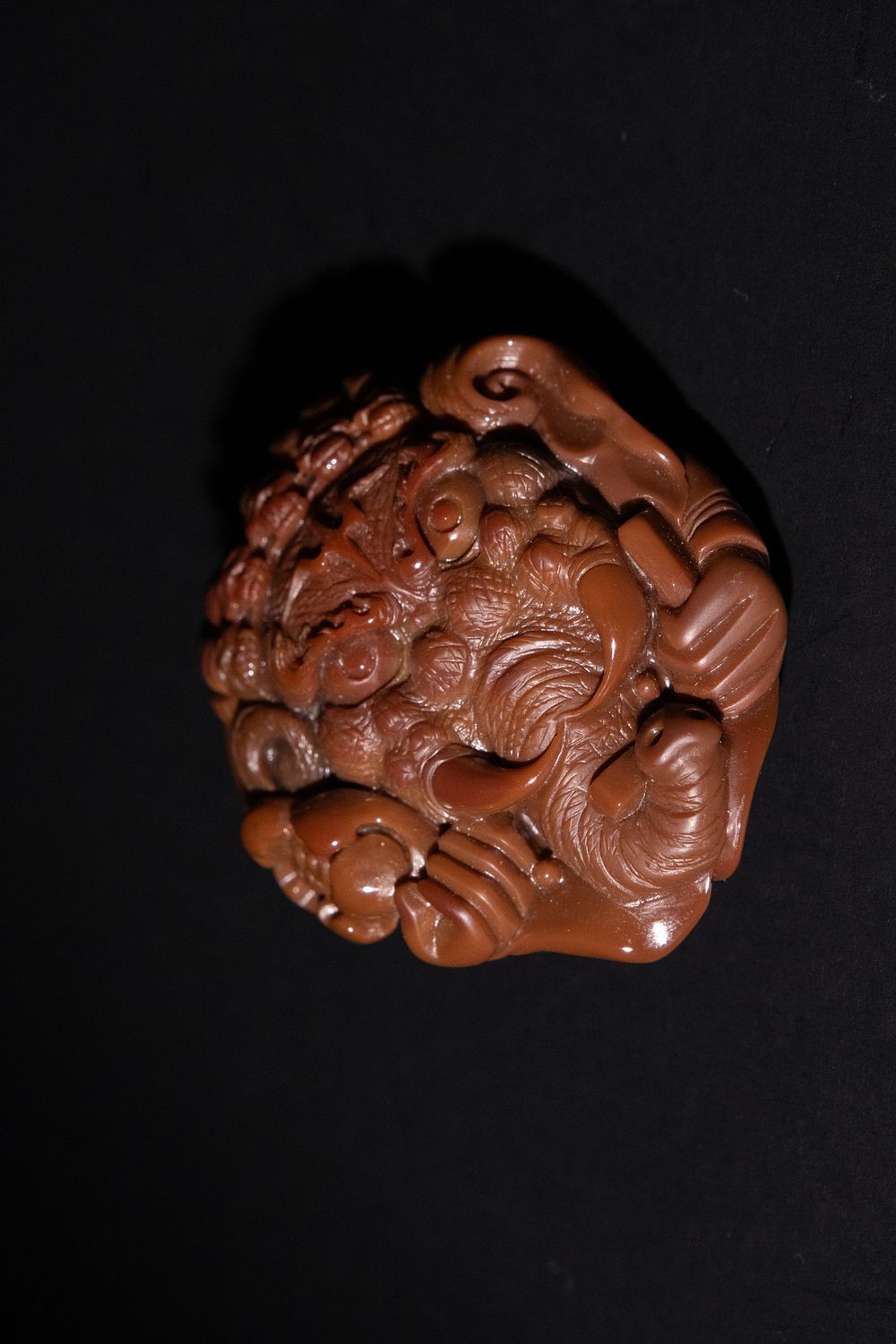 Lot 158: A Chinese Carved Agate Pendant Depicting a Dragon.