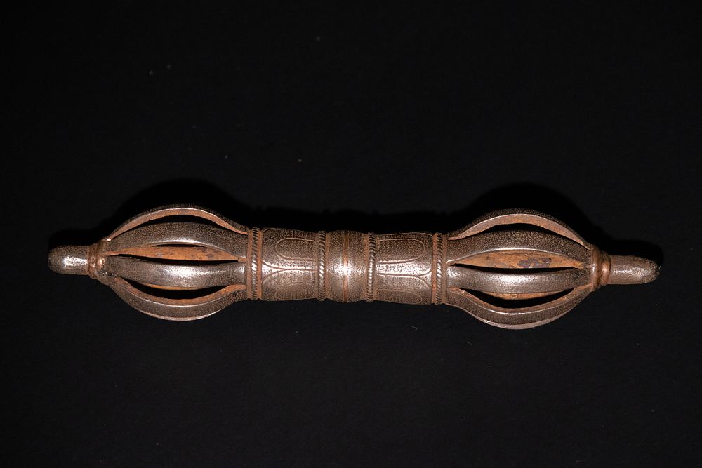 Lot 176: A Tibetan Iron Vajra with Intricate Detailing.