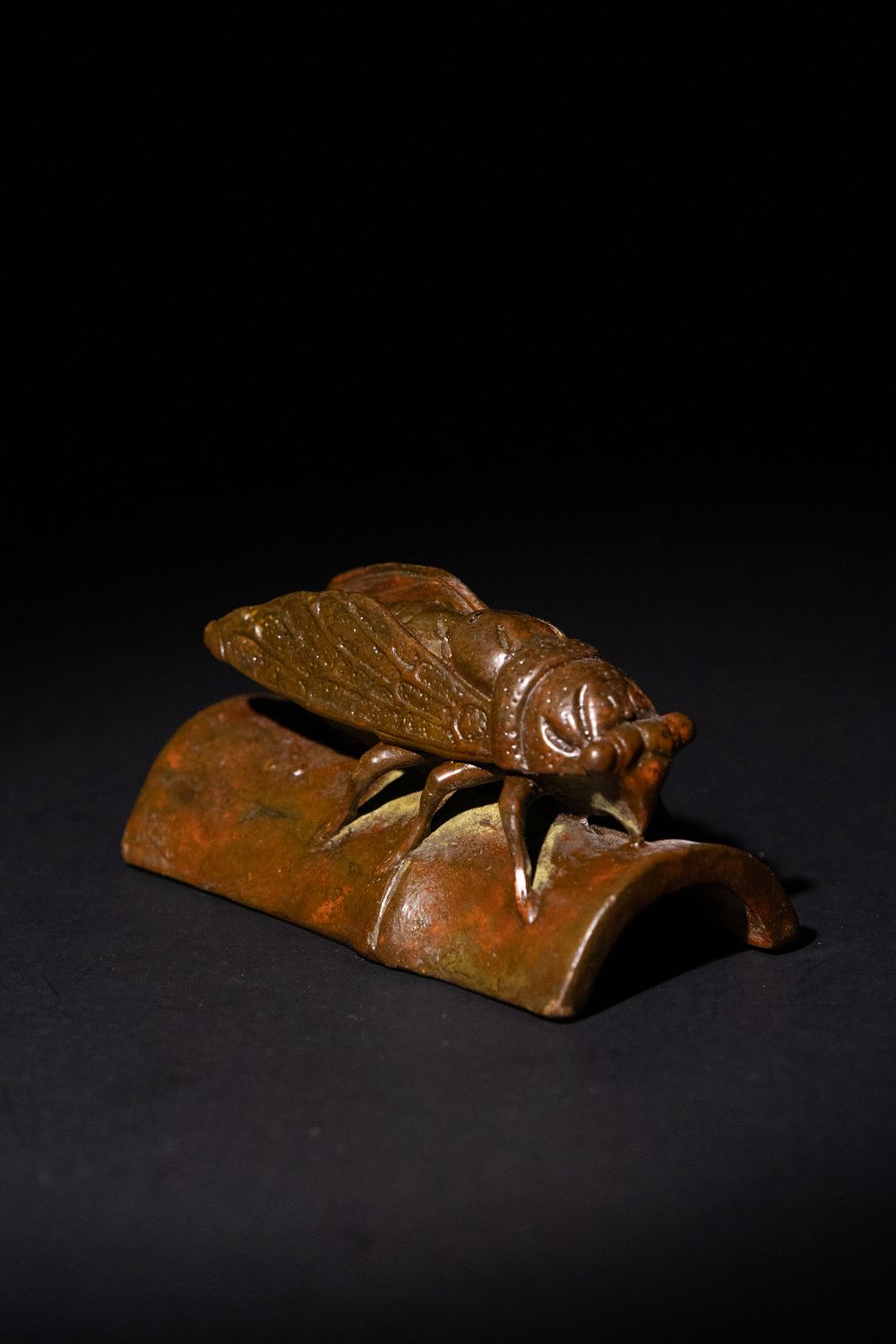 Lot 185: A Japanese Bronze Cicada Figurine on a Curved...