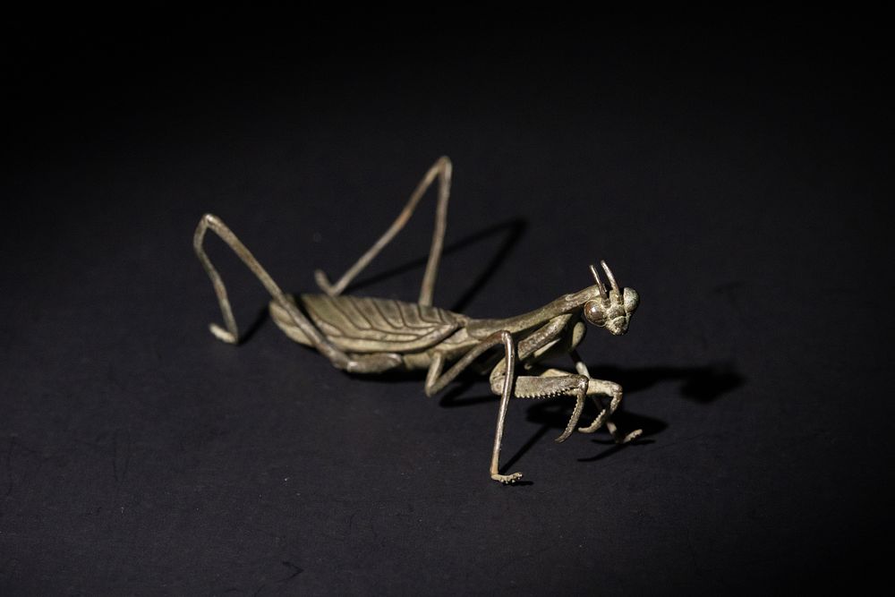 Lot 186: A Japanese Bronze Praying Mantis Figurine.