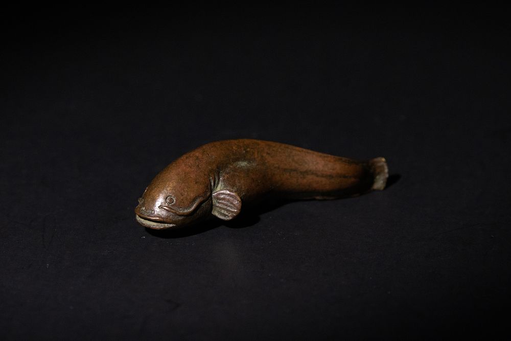 Lot 187: A Japanese Bronze Namazu (Catfish) Figurine.