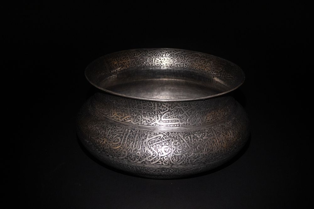 Lot 203: An Indian Deccan Copper Kashkul Beggar's Bowl with...