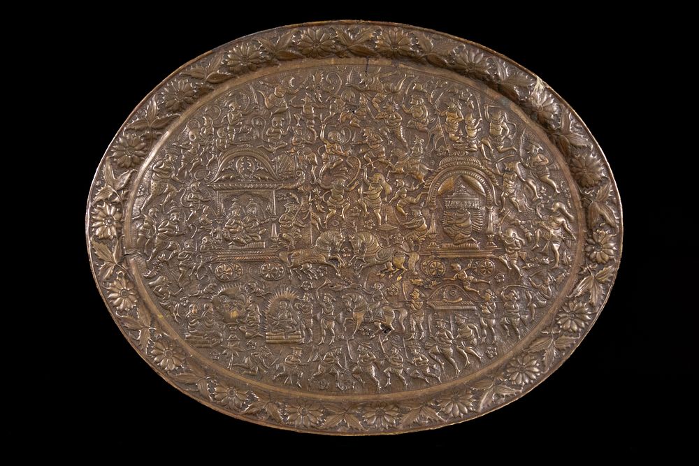 Lot 229: A Large Indian or Burmese Embossed Brass Tray.
