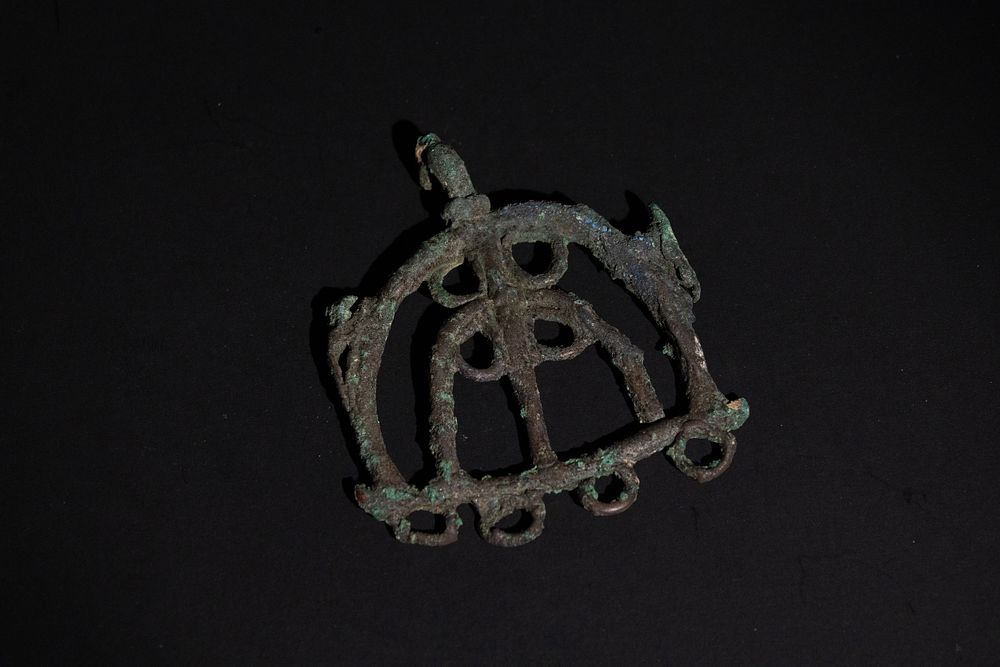 Lot 274: A Luristani Bronze Pendant with Animal Head Terminals,...