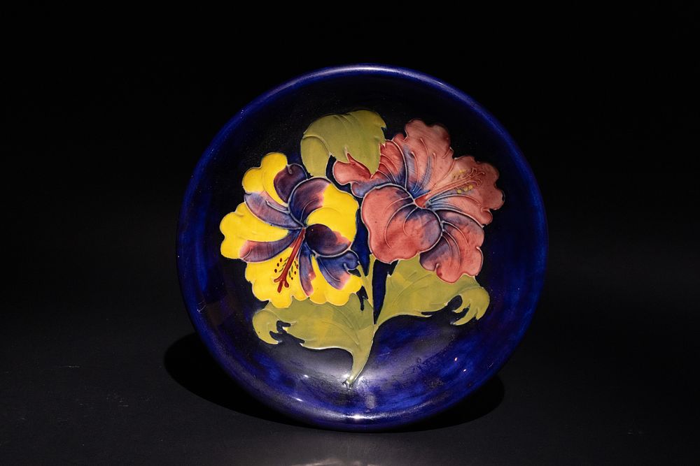 Lot 281: A Moorcroft Cobalt Blue Dish with Hibiscus Motif.
