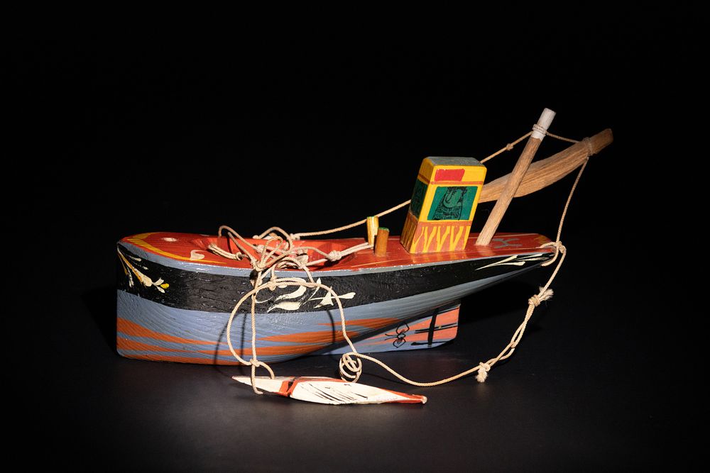 Lot 282: A Sam Smith ‘Gunghadin’ Hand-Carved Wooden Boat.
