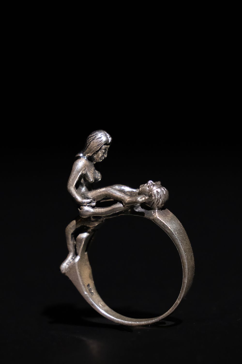 Lot 285: A Silver Erotic Figural Ring.